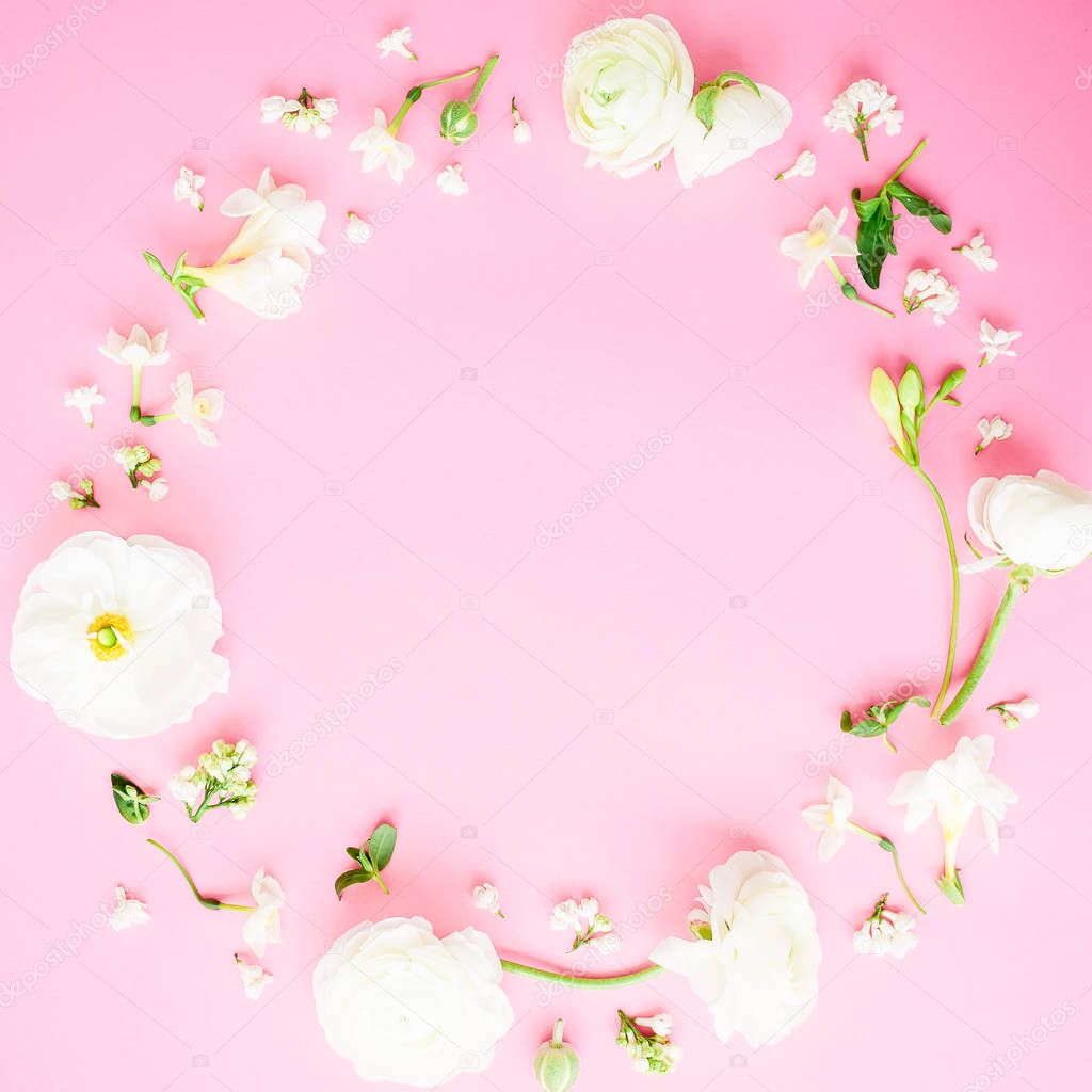 Floral frame made of white flowers on pink background. Flat lay, Top view. Valentines day background