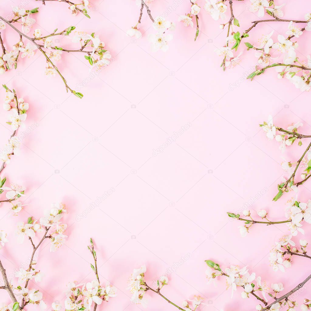Floral composition made from white flowers on pink background. Flat lay, Top view. Valentines day background