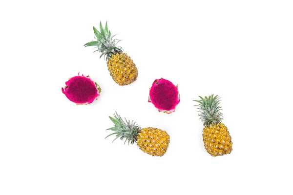 Fruit composition of pineapple and dragon fruits on white backgr — Stock Photo, Image