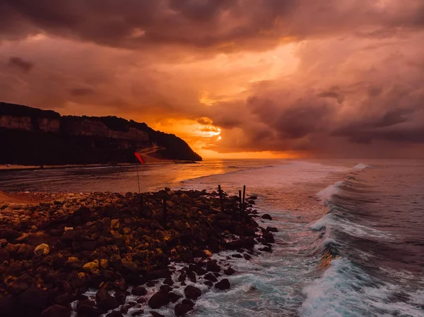 Aerial view of sea with waves, coast and warm sunrise. — Stock Photo, Image