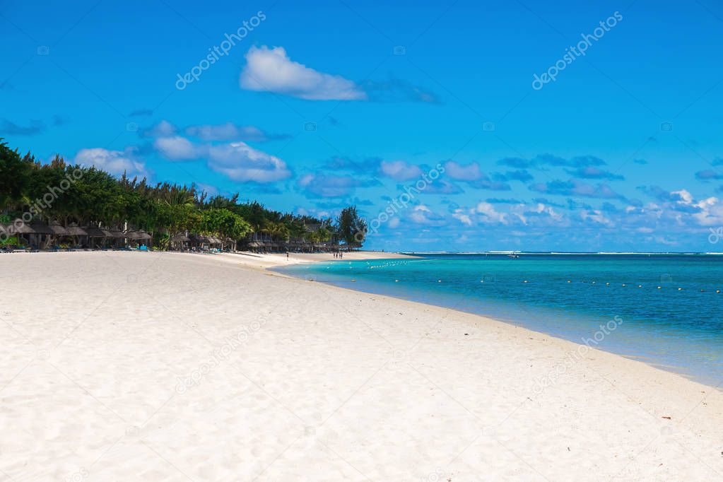 Luxury beach with white sand, palms and ocean. Tropical holiday 