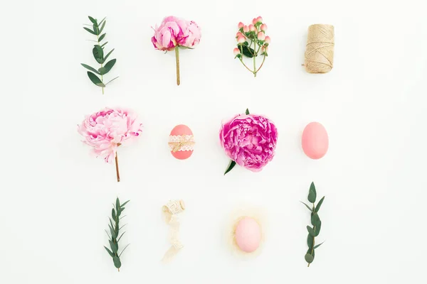 Ester holiday composition with eggs, pink peonies and eucalyptus