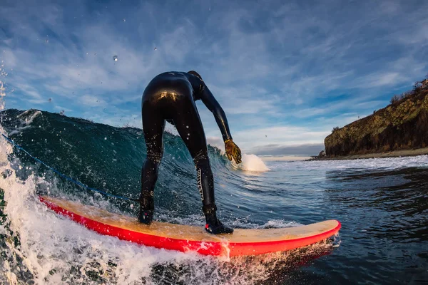December 28, 2019. Anapa, Russia. Surfer in wetsuit on longboard — 스톡 사진