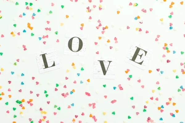 Valentines day composition with Love word and confetti on white — 스톡 사진