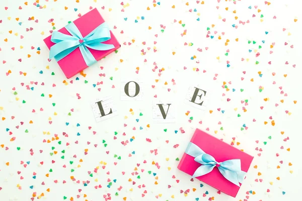 Valentines day composition with Love word and gift with confetti — 스톡 사진