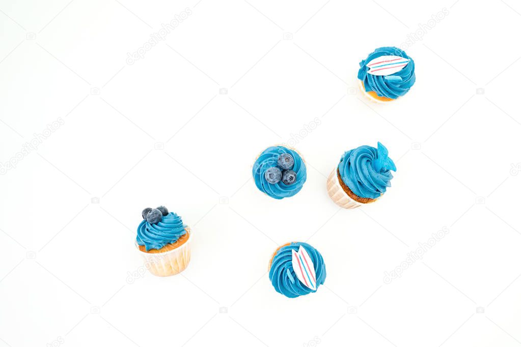 Blueberry muffins with cream isolated on white background. Flat 