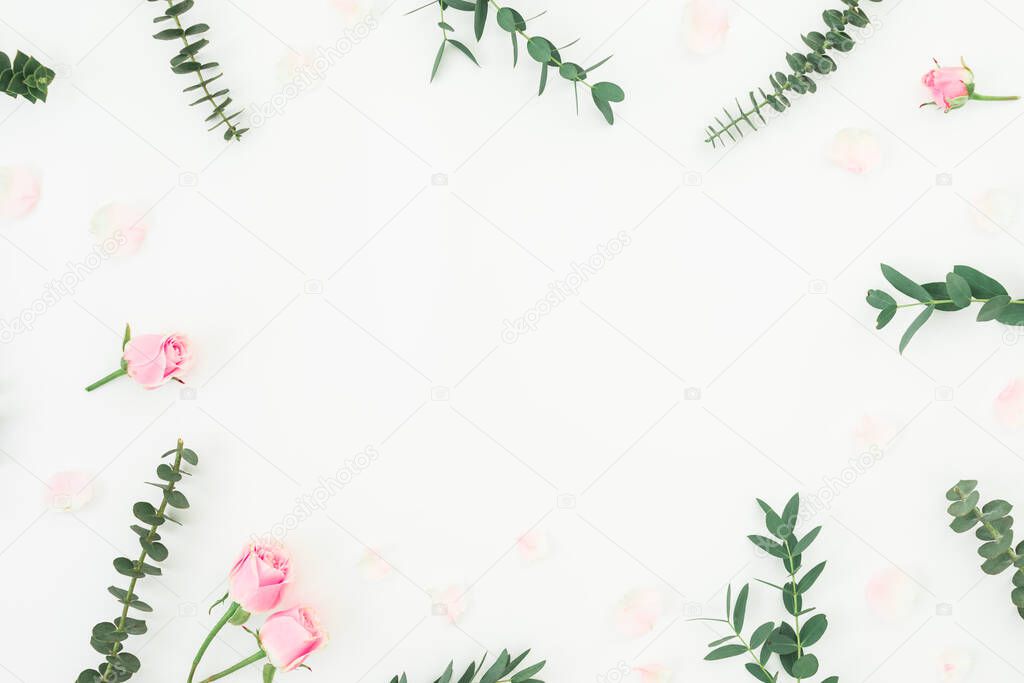 Floral pattern with pink roses and eucalyptus on white background. Flat lay, top view.