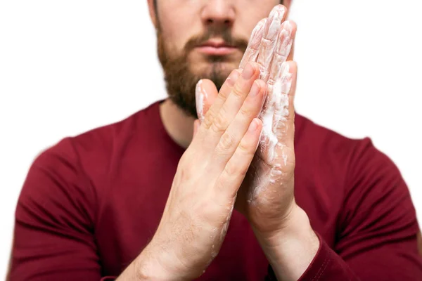 Health beauty and skin care concept. Closeup young bearded man with beard soap or shampoo on his hand for washing beard, cleaning concept — ストック写真