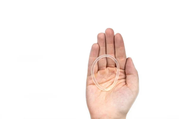 Birth control ring in a womans hand isolated on white background, vaginal ring for contraceptive use — Stock Photo, Image