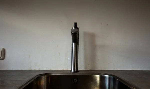 Dirty wall in kitchen with dirty spots behind tap — Stock Photo, Image