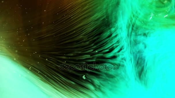 Color ink in water slow motion. Abstract footage on black background. — Stock Video