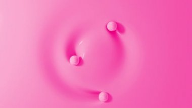 Yumuşak yüzeyde yuvarlanan üç pembe top. Sıvı maddeye dokunan kürelerin üst görüntüsü. 3D canlandırma canlandırması. Kusursuz döngü.