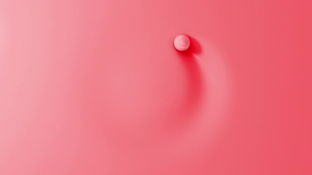 Una Bola Roja Pastel Rodando Alrededor Del Círculo Una Superficie — Vídeos de Stock