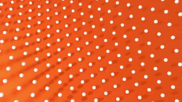 抽象的三维球在橙色熔岩背景和阴影上像波浪一样运动 无缝循环动画 — 图库视频影像