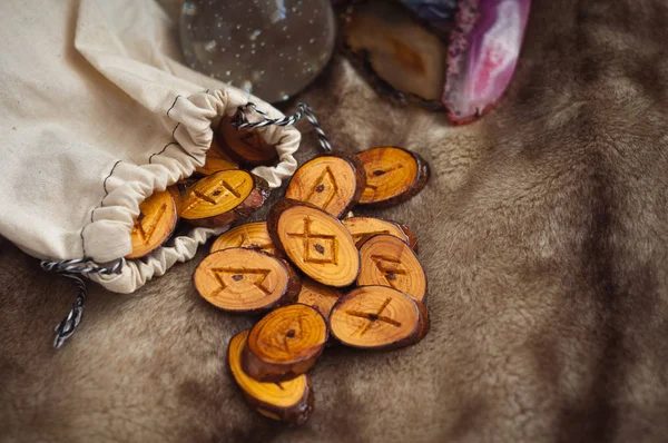 Wooden runes on the fur — Stock Photo, Image
