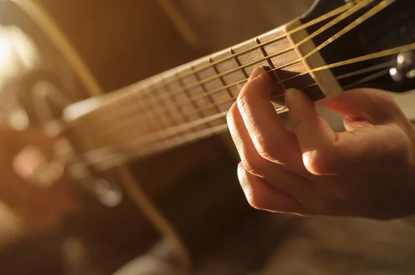 Playing acoustic guitar — Stock Photo, Image