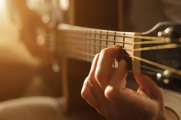 Playing acoustic guitar — Stock Photo, Image