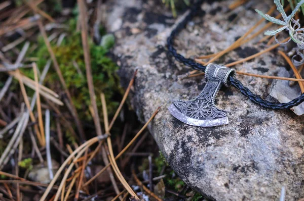 Silver amulet hammer of Thor in the forest — Stock Photo, Image