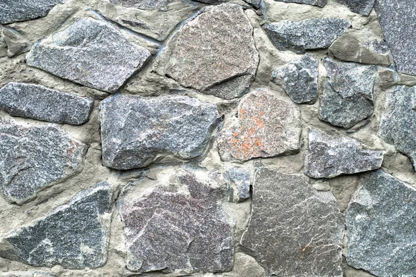 Tekstura kamiennej ściany. Może być używany jako tło — Zdjęcie stockowe
