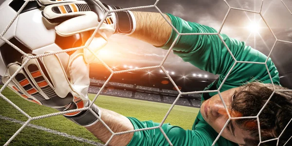 Goalkeeper catches the ball in the stadium — Stock Photo, Image