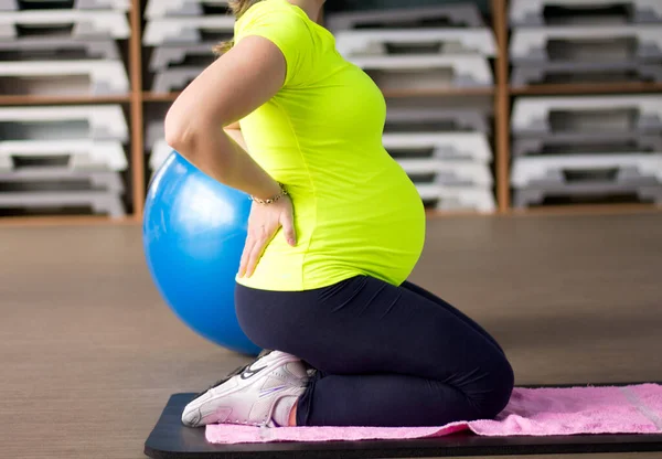 Future mother on prenatal yoga fitness class.