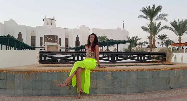 Woman visting a luxurious hotel in Egypt as summer holiday destination.