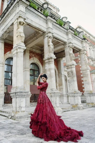 Beautiful witch in purple dress — Stock Photo, Image