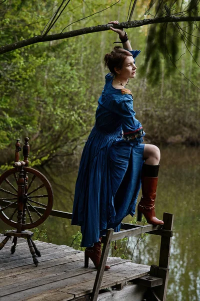 Pretty girl in long dress at the deep dark forest — Stock Photo, Image