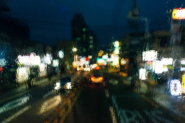 Inside the car. Abstract blurry in rainy day for background. Rain drops, water drops on car windscreen — 스톡 사진