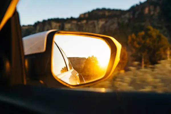 Sunset in a rear view mirror in nevada — 스톡 사진