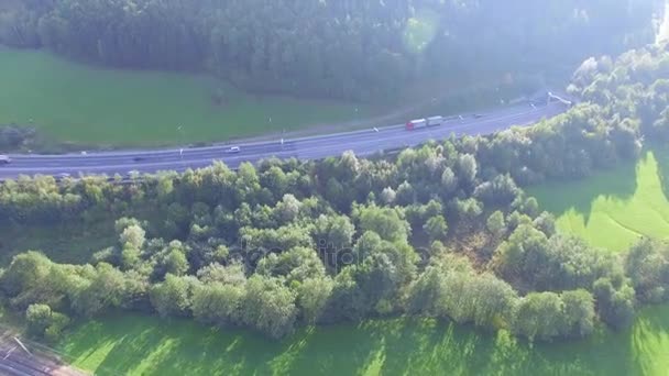 Moottoritie A 9 Itävallassa, Aerial view of highway with traffic at the tunnel entrance in the Alps in Austria, Europe — kuvapankkivideo