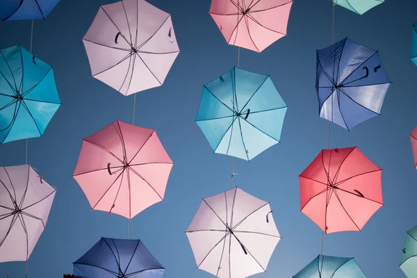 Colored open umbrellas on sky background. — Stock Photo, Image