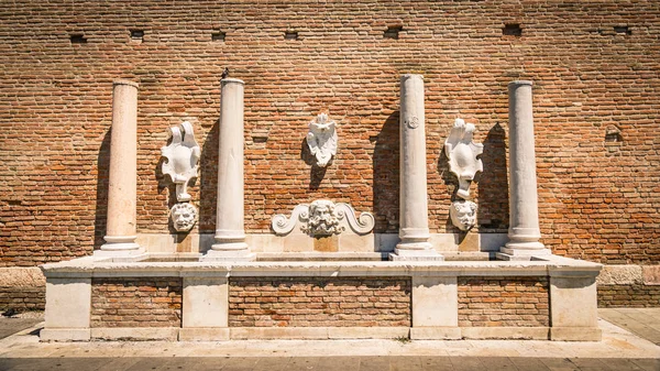 Ancient stone fountain depicting the god Neptune and other roman — Stock Photo, Image