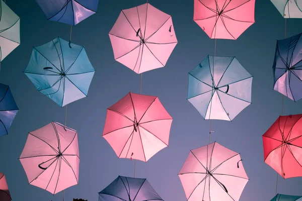 Colored open umbrellas on sky background. — Stock Photo, Image