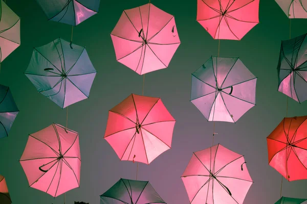 Colored open umbrellas on sky background. — Stock Photo, Image