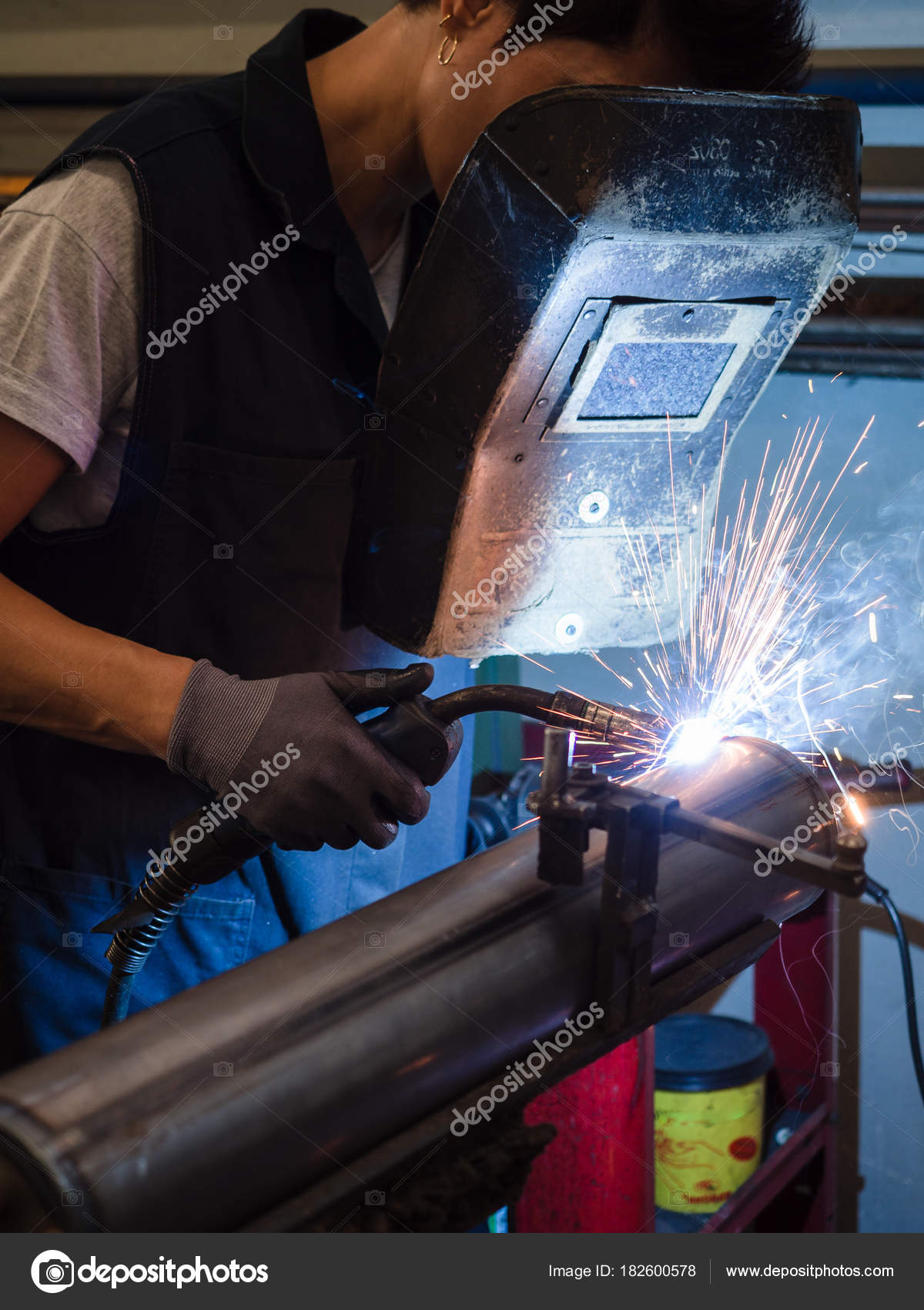 Use of wire welding machine in a Stock Photo by ©Isaac74