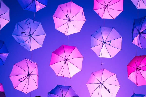 Colored open umbrellas on sky background. — Stock Photo, Image