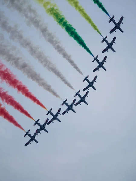 Aerobatic airshow with italian flag colors.