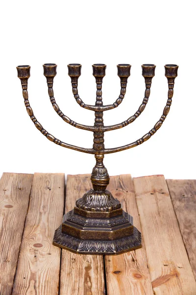 Ancient ritual candle menorah on a wooden table — Stock Photo, Image