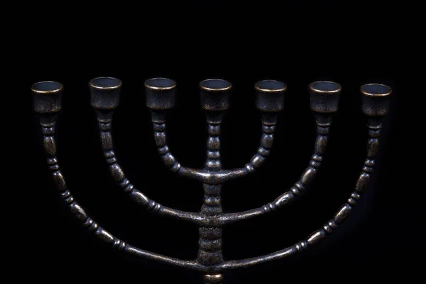 Ancient ritual candle menorah on a black background — Stock Photo, Image