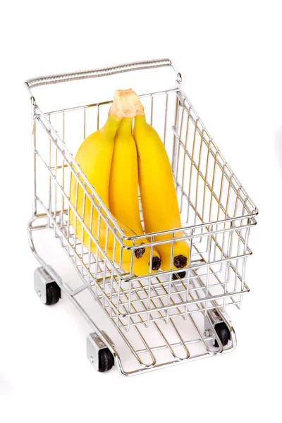 Caminhão em miniatura com bananas sobre fundo branco — Fotografia de Stock