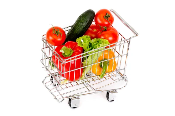 Miniatyr vagn med grönsaker på en vit bakgrund — Stockfoto