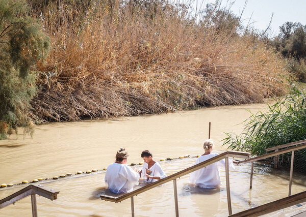Ritual bath in the Jordan river. pilgrimage to the Holy Land
