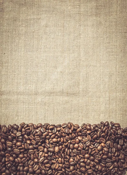 Coffee menu. Roasted coffee beans on the background of linen fabric