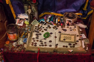 Ancient book of voodoo spells. Exhibition in the Museum of Voodoo History, New Orleans, Louisiana, USA clipart