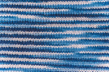 Örgü. Mavi örme kumaş dokusuna