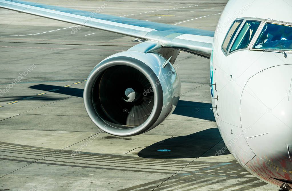 Frederic Chopin International Airport, Warsaw. The engine and wing of a passenger airplane