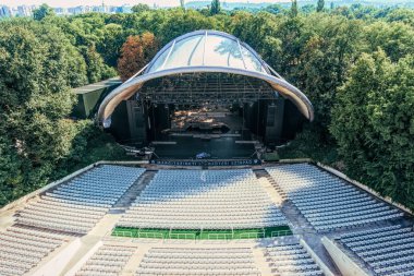 Budapest, Hungary - August 29, 2019: Stage under the dome and seats of the summer concert hall in a city park on Margaret Island in Budapest, Hungary. Summer holidays and music concerts in the capital of Hungary