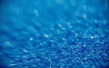 Soyut arkaplan ve doku. Mavi sentetik yüzeyde parlak gölgeler