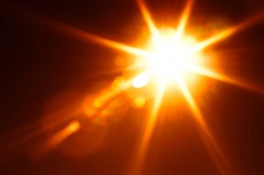 Çapraz turuncu parlak güneş parlaması arka plan